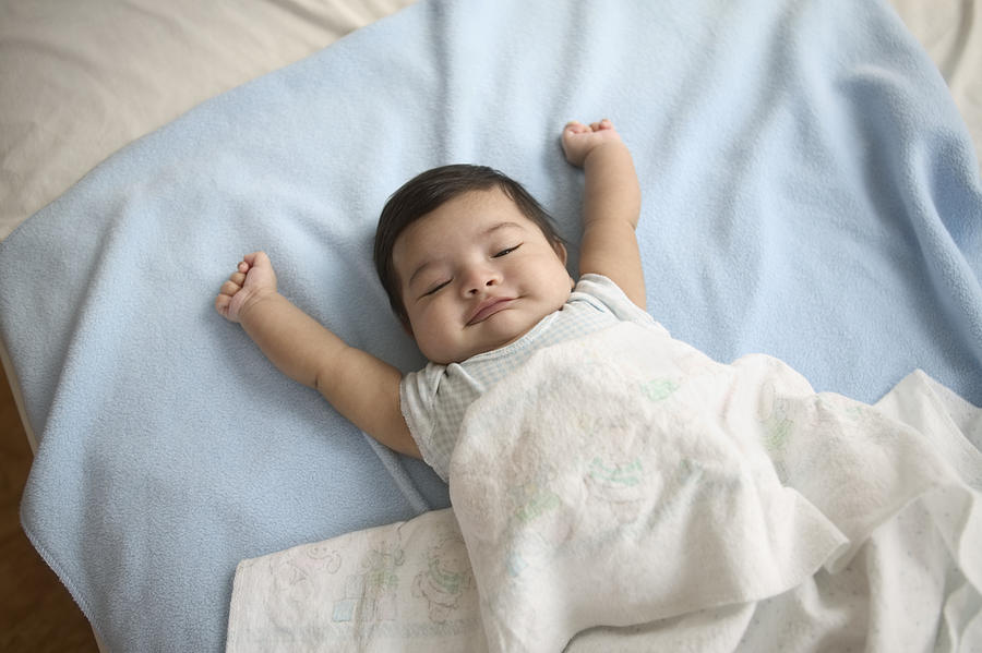 High angle view of a baby boy sleeping on a bed Photograph by Jose Luis Pelaez Inc