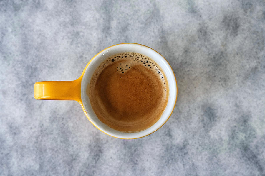 High angle view of a cup of expresso on marble surface. Photograph by Emreturanphoto