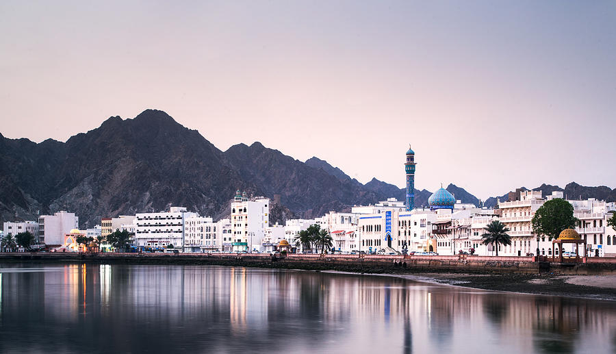 High Angle View Of Buildings And Mountains Against Sky - stock photo Photo taken in Muscat, Oman Photograph by Kan Wang