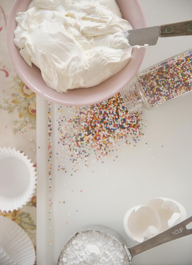 High angle view of frosting and sprinkles Photograph by Jamie Grill