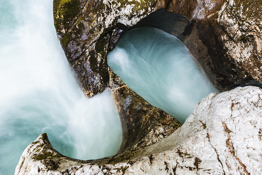 High angle view of water swirling near rock formations Photograph by Jeremy Woodhouse