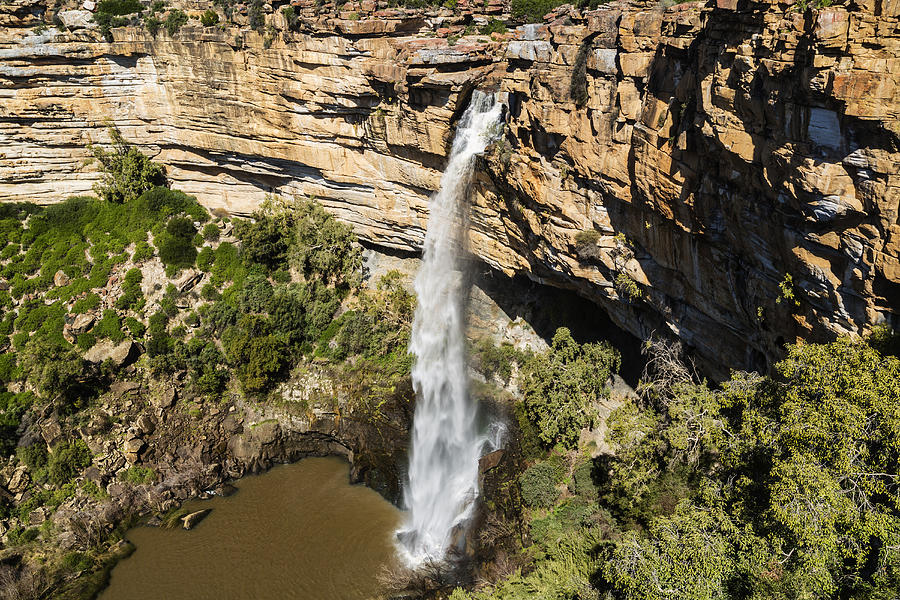 High angle view of waterfall flowing over rocky cliff Photograph by Jeremy Woodhouse