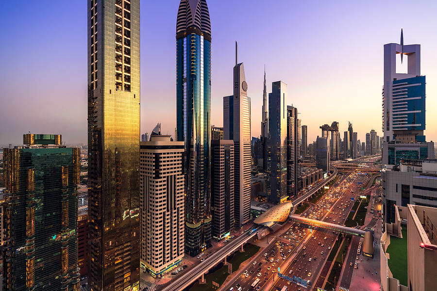 High angle views of urban skyline and skyscrapers at sunset in Dubai UAE. Photograph by Lu ShaoJi