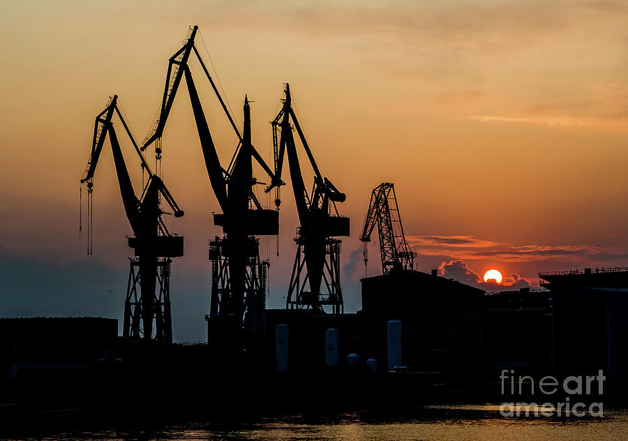 High Cranes At Sunset In Harbor Docks Of Pula Croatia Photograph by Andreas Berthold