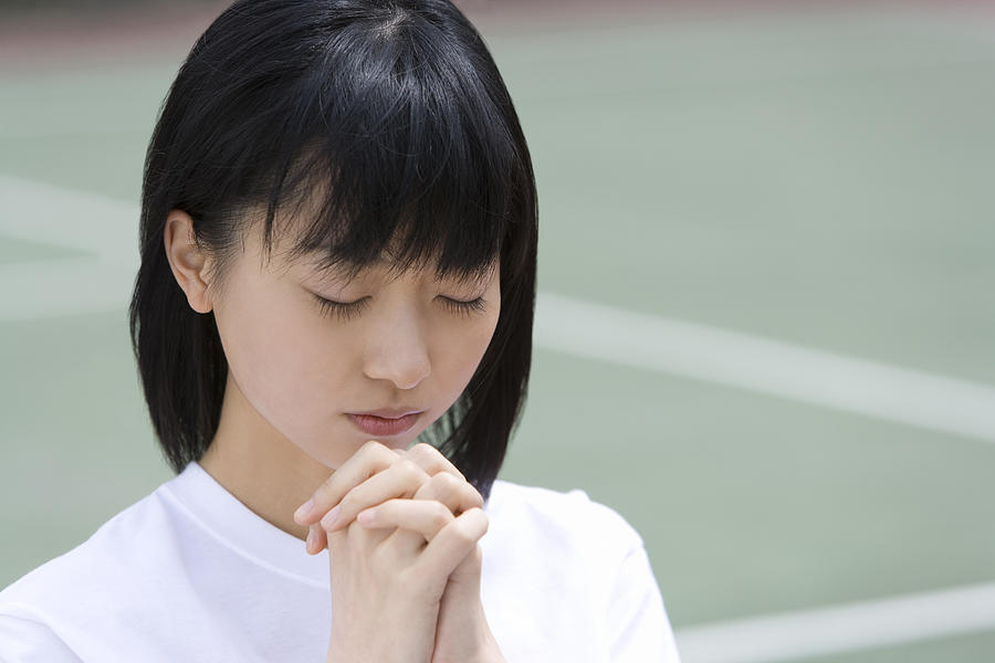 High School Girl Praying for Win Photograph by Daj