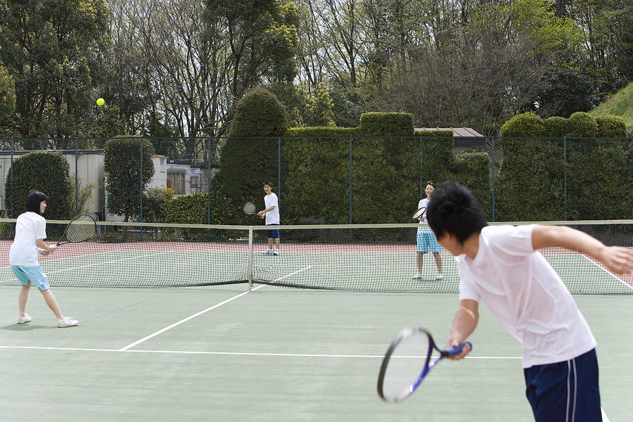 High School Students Playing Tennis on Ground Photograph by Daj