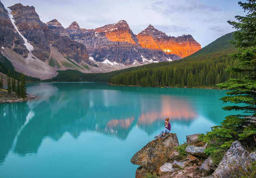 Hiker and Mountian Sunrise at Moraine Lake Photograph by Bill Cubitt