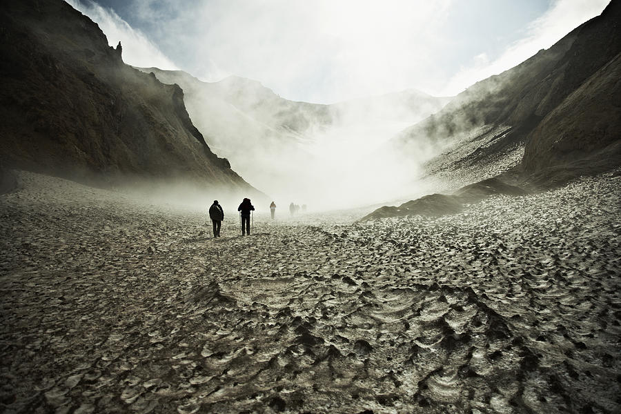 Hikers trekking through the Mutnovsky Volcano, Kamchatka, Russia Photograph by Markus Renner