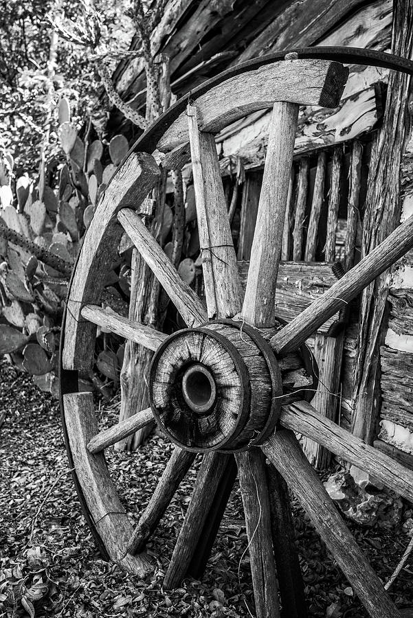 Hill Country Wagon Wheel in black and white Photograph by Lynn Bauer