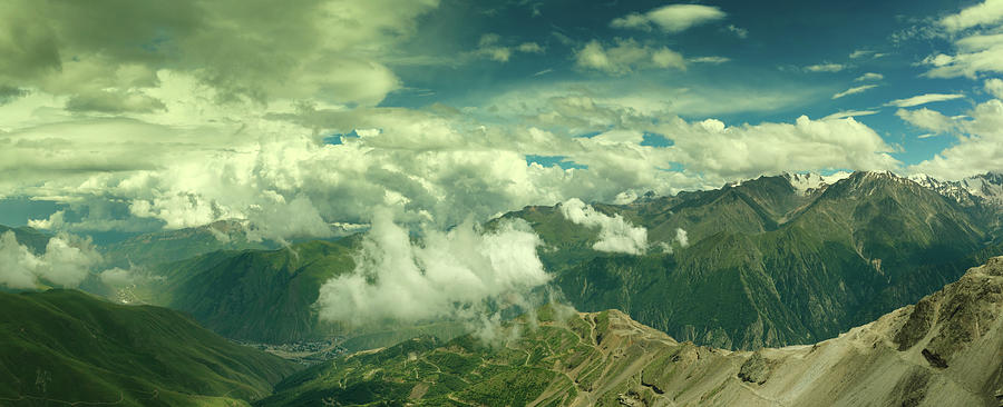 Hills and mountains under clouds Photograph by Mikhail Kokhanchikov