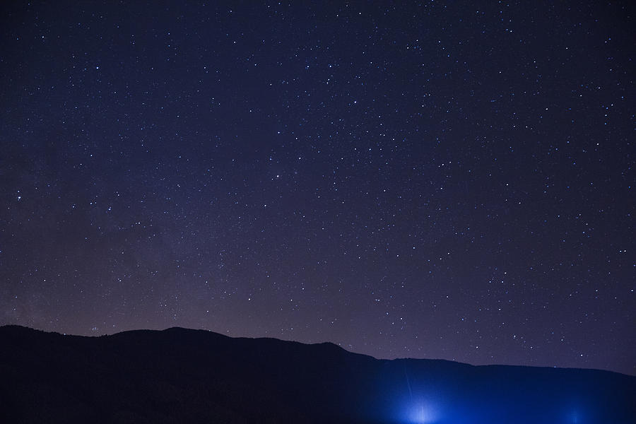 Hillside at night with stars Photograph by Erik Von Weber