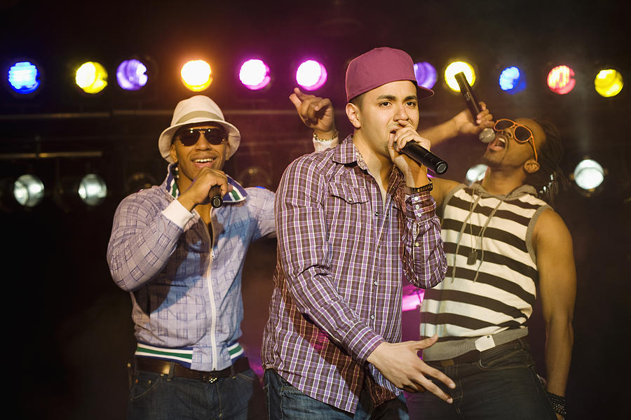 Hip hop musical group performing onstage Photograph by Jon Feingersh Photography Inc