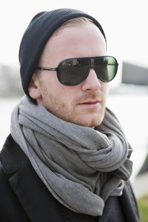 Hipster in grey scarf and sunglasses Photograph by Andreas Schlegel