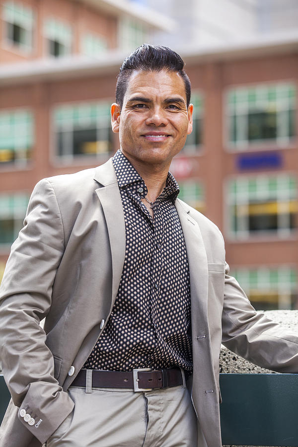 Hispanic businessman smiling outdoors Photograph by Adam Hester