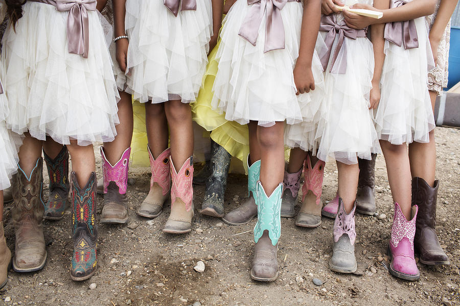 Hispanic girls wearing cowboy boots at quinceanera Photograph by Hill Street Studios