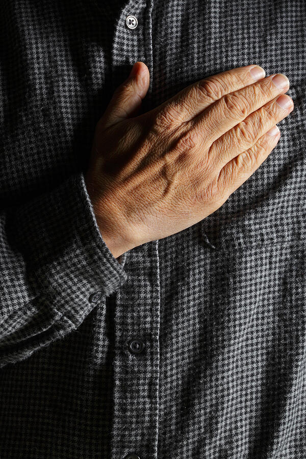 Hispanic man placing his hand over his heart Photograph by Dny59 Hispanic man placing his hand over his heart Photograph by Dny59