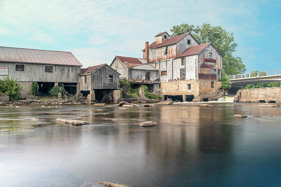 Historic Mill by a River Photograph by John Twynam
