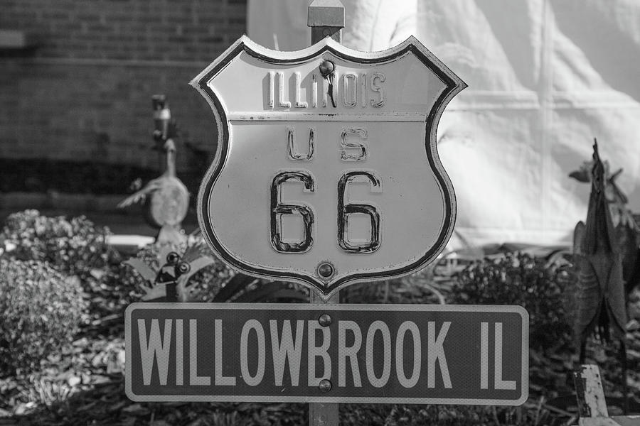 Historic Route 66 road sign in Willowbrook Illinois in black and white Photograph by Eldon McGraw