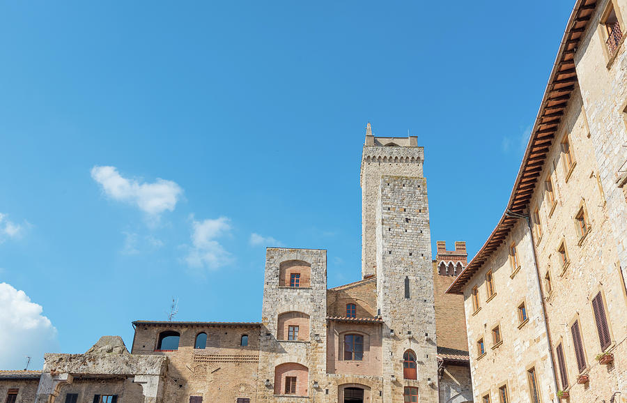 Historical architecture buildings, San Gimignano city Tuscany, Italy against blue sky Photograph by Michalakis Ppalis