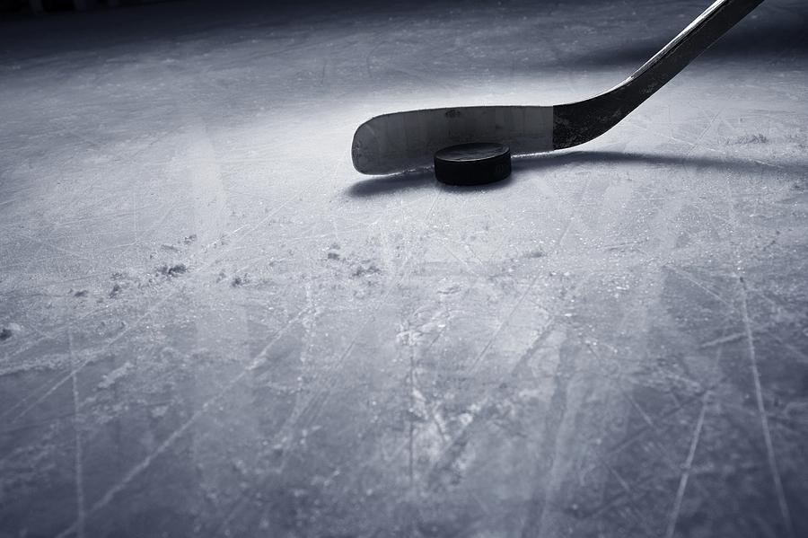 Hockey Stick and Puck on Ice Photograph by Francisblack