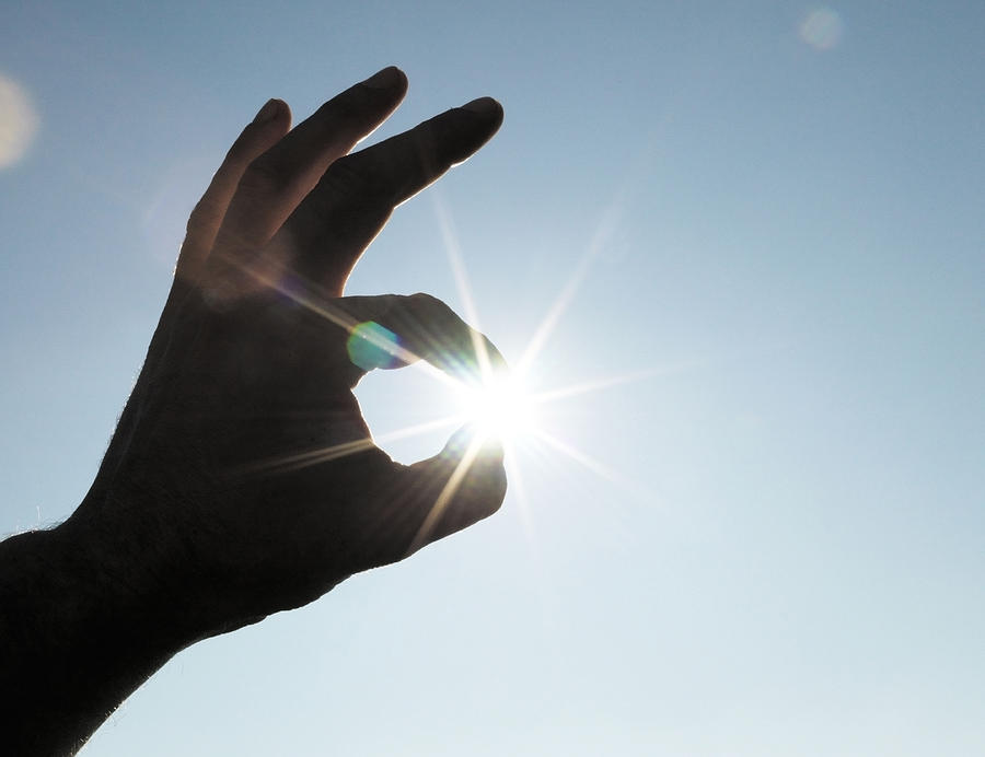 Holding the sun in the fingers. Photograph by David Trood
