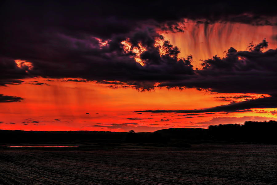 Holes in The Sunset Storm Photograph by Dale Kauzlaric
