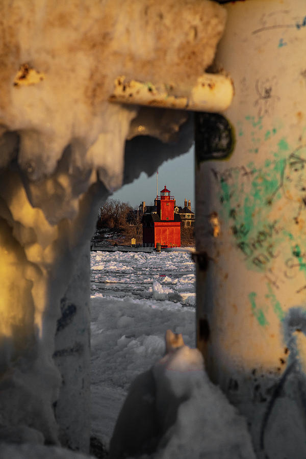 Holland Michigan Lighthouse peaking through the ice Photograph by Eldon McGraw