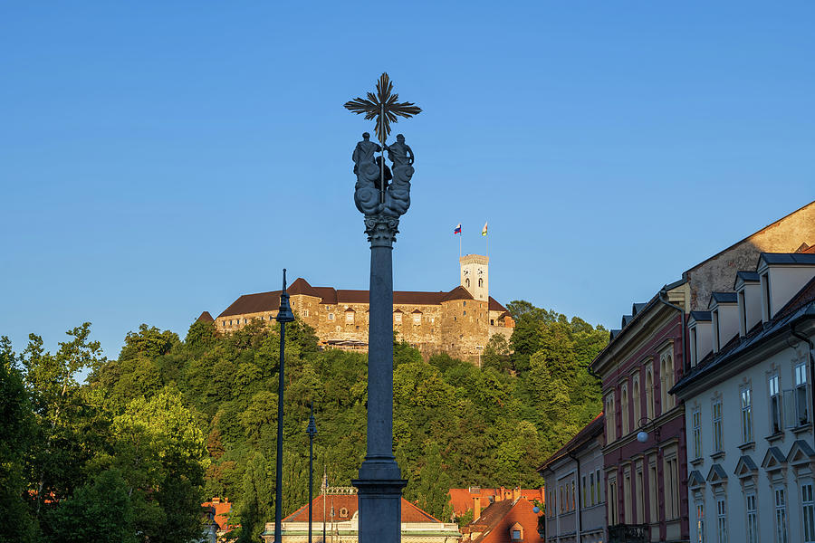 Holy Trinity Column and Ljubljana Castle Photograph by Artur Bogacki