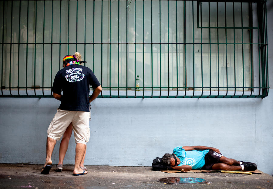 Homeless man sleeping while drunk couple makes out above him Photograph by Epicurean