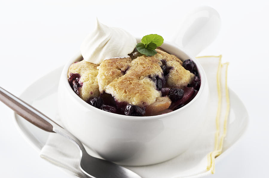 Homemade blueberry cobbler in a white bowl Photograph by NightAndDayImages