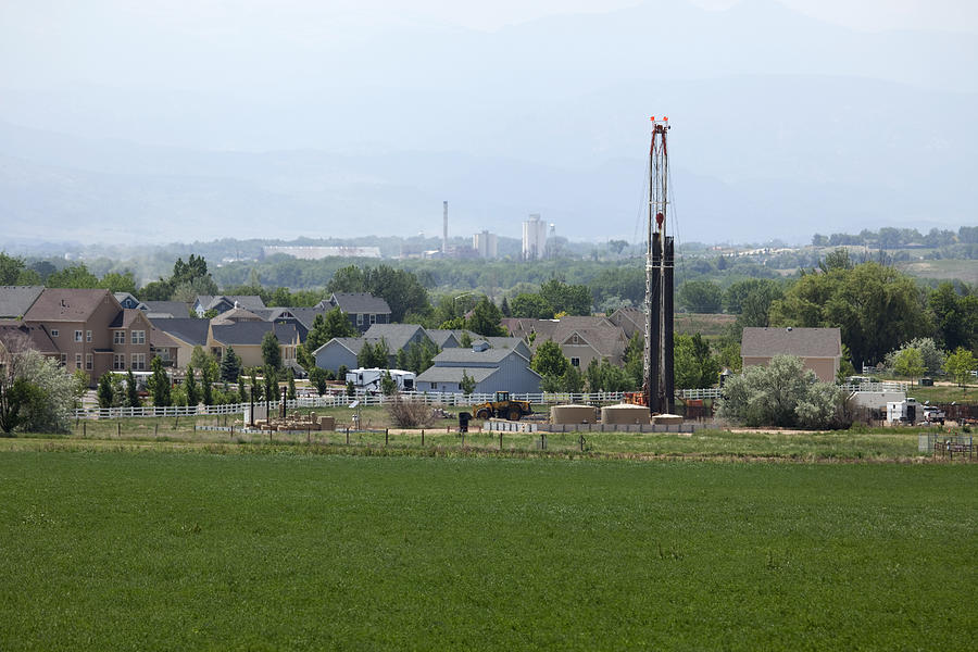 Homes and natural gas drill rig Frederick Colorado Photograph by Milehightraveler