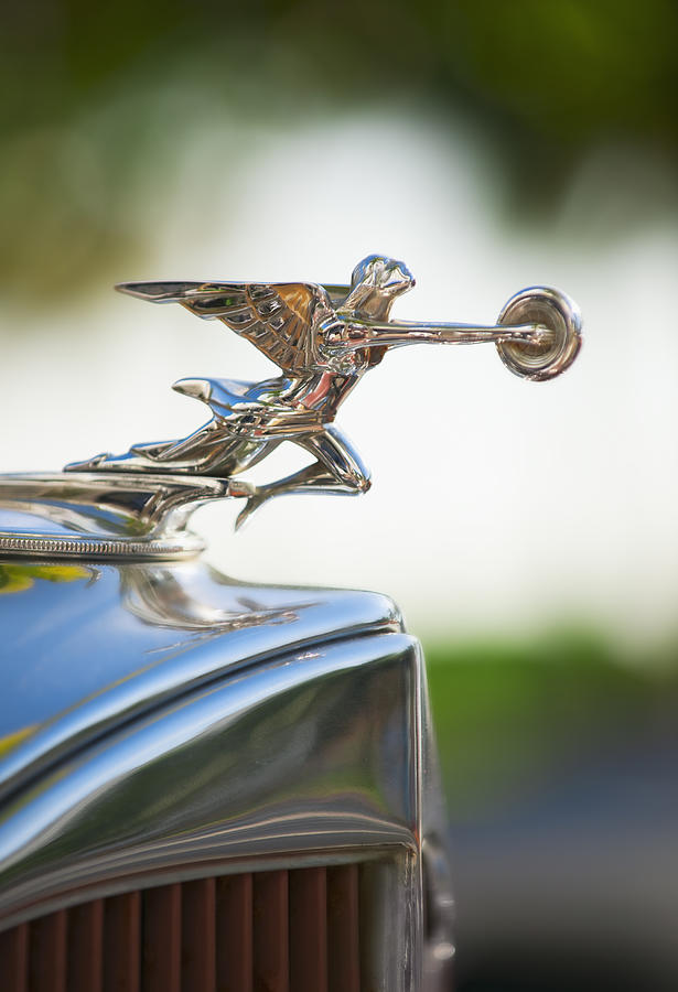 Hood ornament on classic car Photograph by Tetra Images