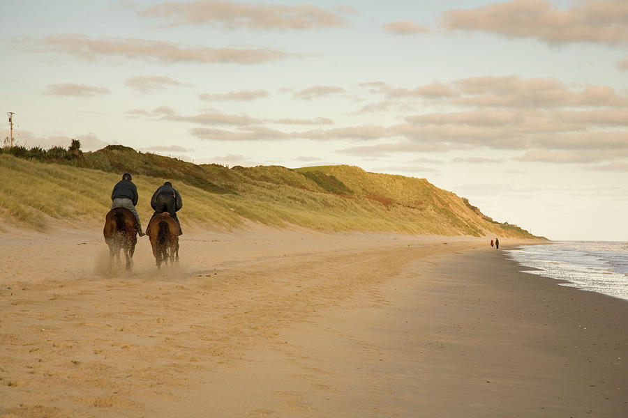 Horse riders on Blackwater beach, County Wexford, Ireland. Photograph by Ian Middleton
