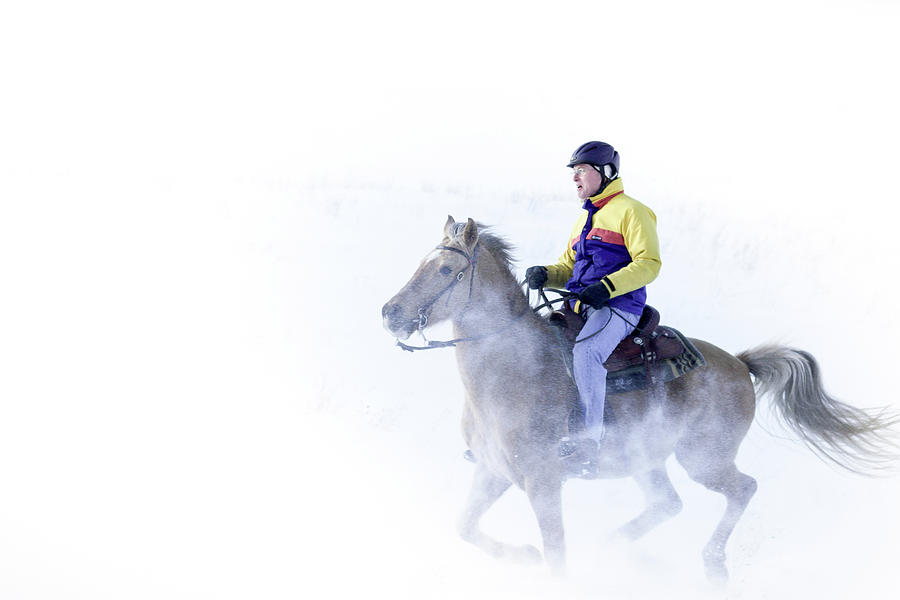 Horseback riding in the winter Photograph by Nick Mares