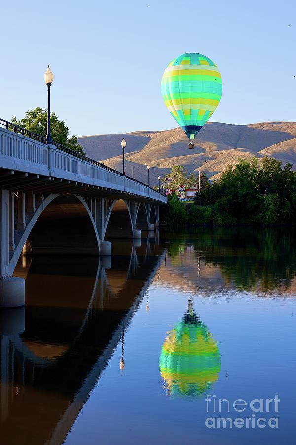 Hot Air Balloon Floating over Prosser with Bridge Photograph by Carol