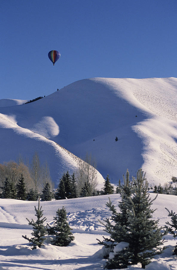 Hot air balloon over Snowy Mountains,  Sun Valley, Idaho, USA Photograph by Karl Weatherly