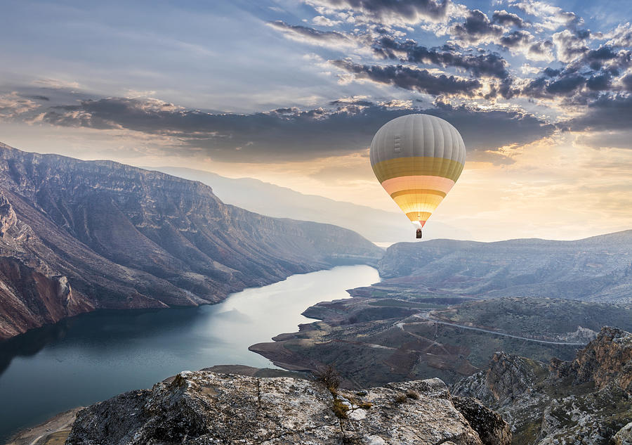 Hot air balloons flying over the Botan Canyon in TURKEY Photograph by Guvendemir