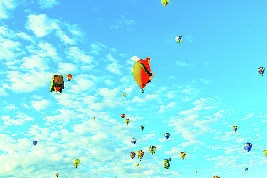 Hot air balloons in a bright blue sky Photograph by Jeff Swan