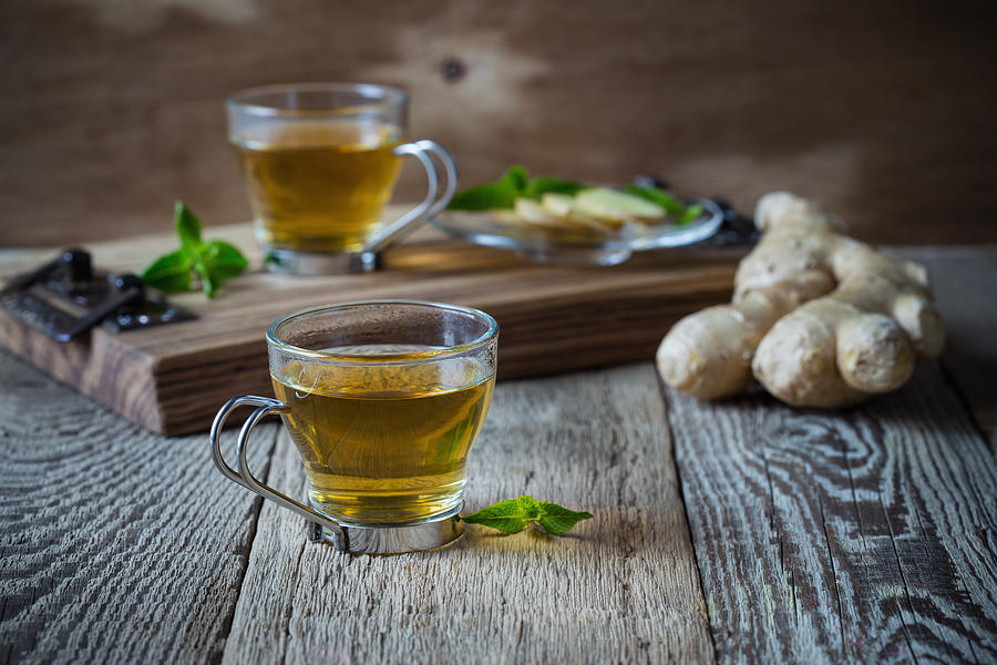 Hot ginger and mint tea, homemade green tea health benefits Photograph by Istetiana