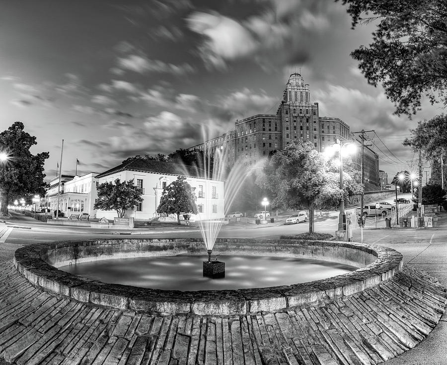 Black And White Photograph - Hot Springs Fountain and Bathhouse Row Skyline at Dusk - Black and White by Gregory Ballos