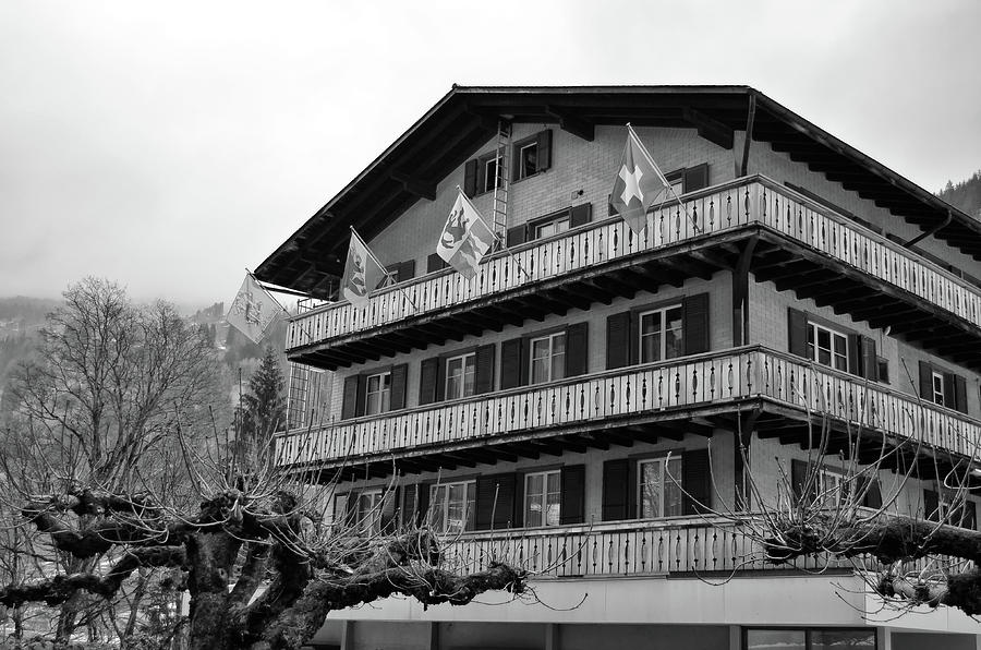 Hotel Flags in Lauterbrunnen Village Jungfrau Region Early Spring Switzerland Black and White Photograph by Shawn OBrien