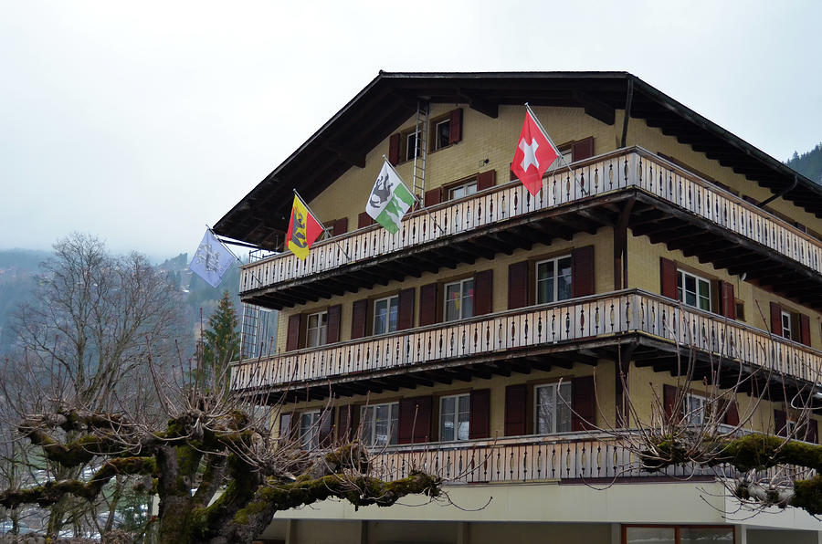 Hotel Flags in Lauterbrunnen Village Jungfrau Region Early Spring Switzerland Photograph by Shawn OBrien