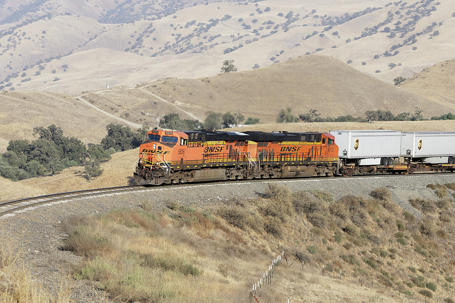 Hotshot -- BNSF ES44AC and ES44C4 Pulling an Intermodal Train in the Tehachapi Mountains, California Photograph by Darin Volpe