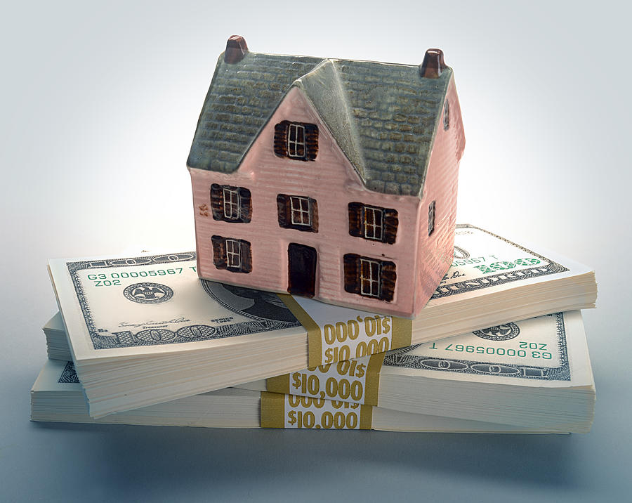 House model on money Photograph by ATU Images