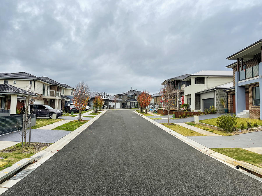 Houses along suburban street and overcast sky Photograph by Andrew Merry Houses along suburban street and overcast sky Photograph by Andrew Merry