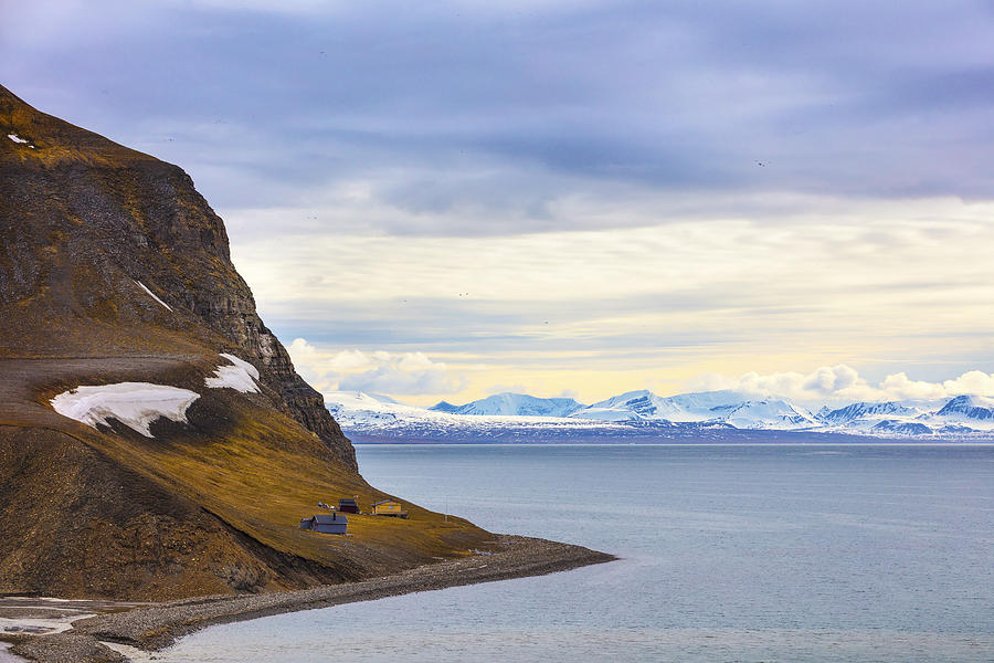 Houses and mountains in arctic summer landscape Photograph by Kjekol