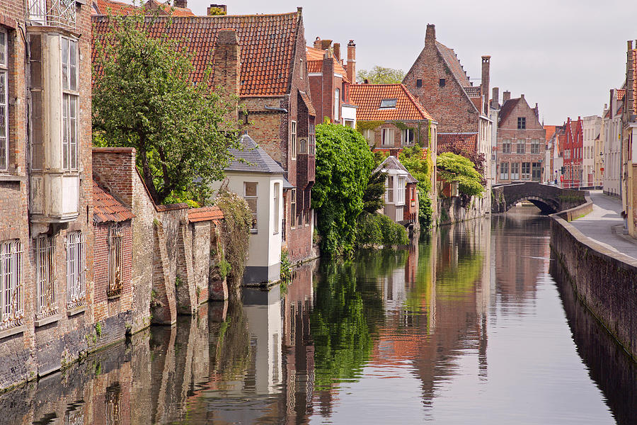 Houses near the water canal in Bruges, Belgium Photograph by Alexander Spatari