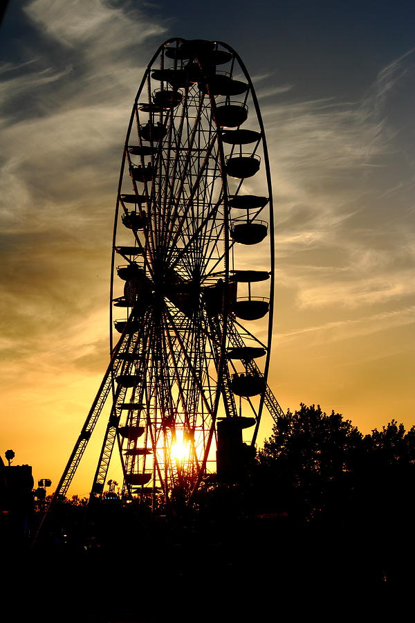 Huge ferris wheel at sunset Photograph by Pejft