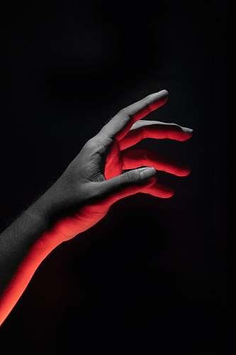 Human hand in red light in the dark Pyrography by Ademola Oshodi - Fine ...