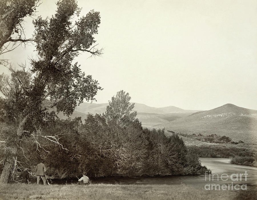 Hunters alongside the Laramie River in the Laramie Mountains, 1869 Photograph by Andrew Joseph Russell